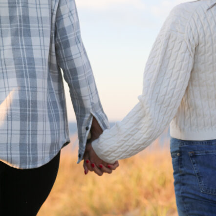 Couple holding hands