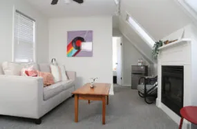 Cozy living room with sofa, coffee table and fireplace
