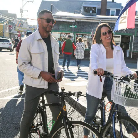 Two guests with bikes enjoying a sunny day